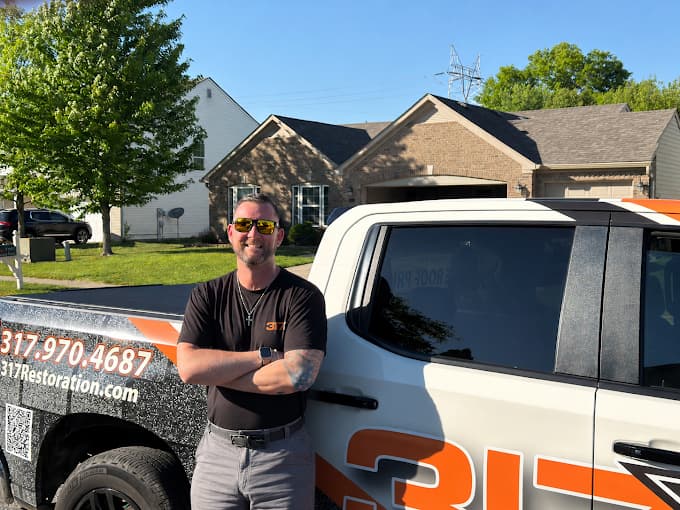 David Denton, founder of 317 Roofing Co., with the 317 Roofing Co. truck