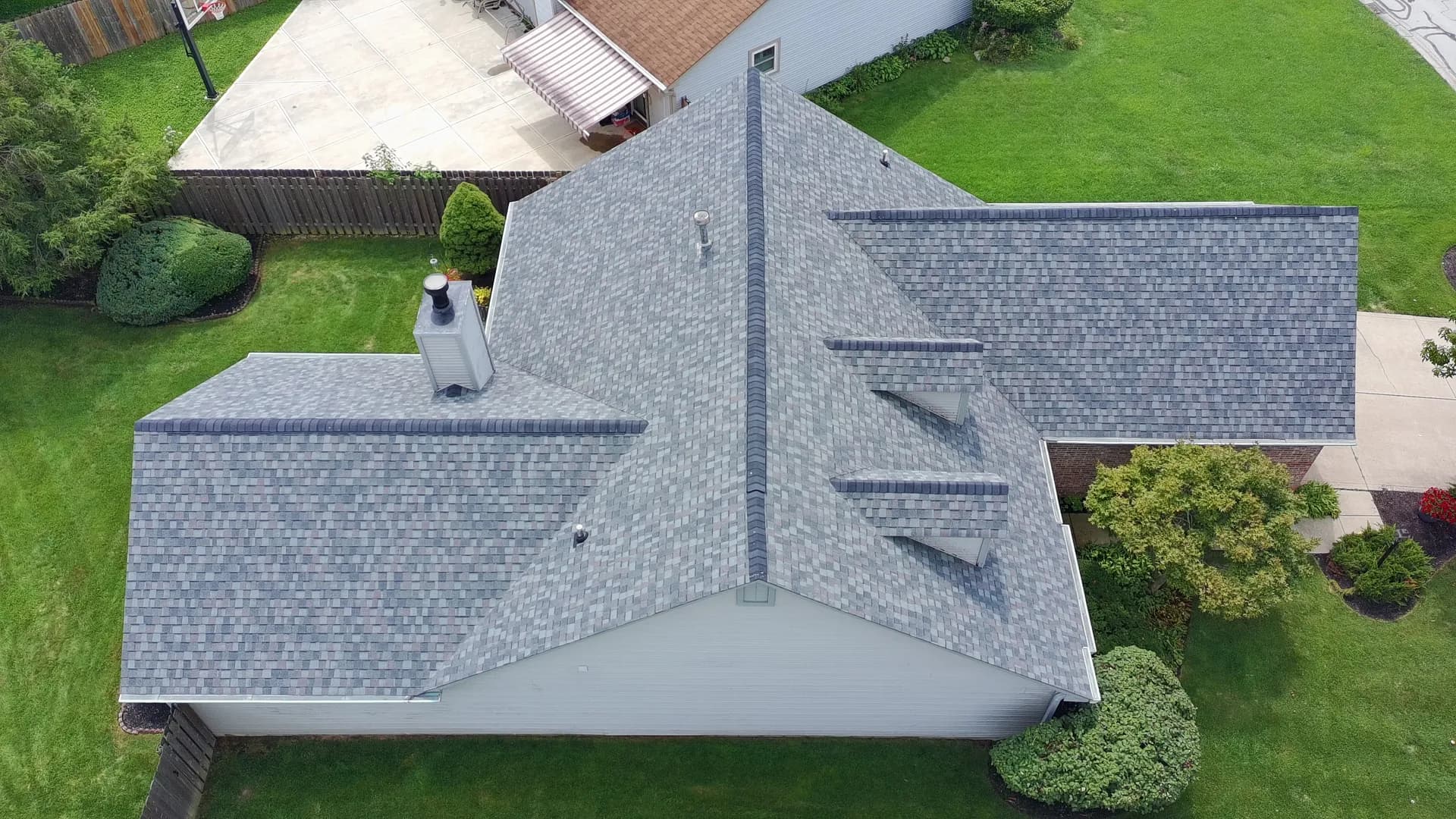 Aerial view of a finished 317 Roofing Co. roof showing ridge cap, vents and valleys